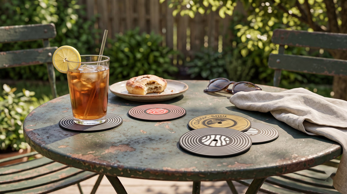Vinyl record coasters with iced tea on a garden bistro table in the sun